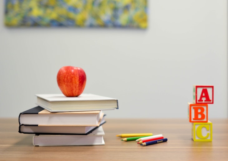 Classroom materials including an apple and blocks