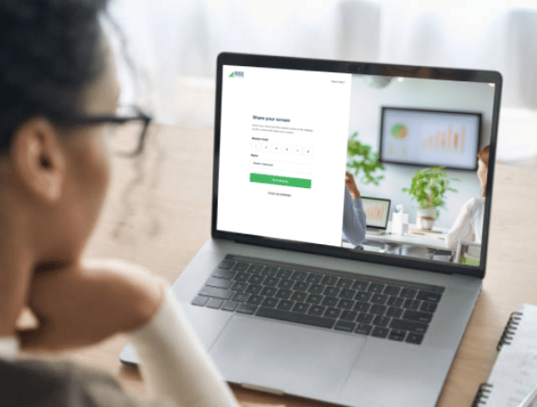 A female joining a Rise Vision screen sharing session on her laptop