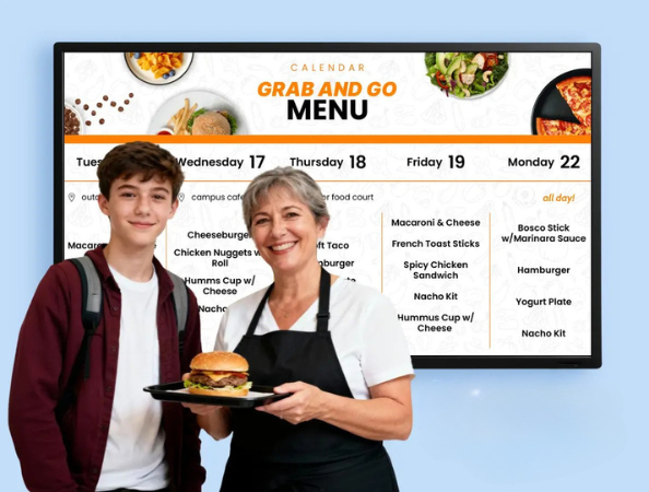 A student and lunch lady standing in front of a digital menu display