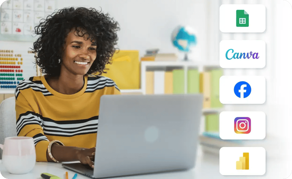 A black female educator sitting in front of her laptop and viewing Rise Vision integrations