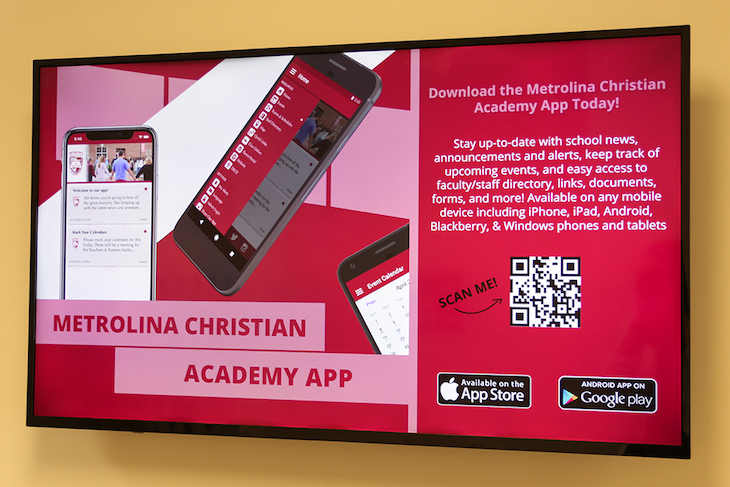 Metrolina Christian Academy App displayed on signage with QR code