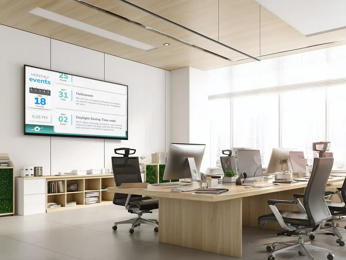 Modern office setting with a digital calendar display hanged on a large backwall