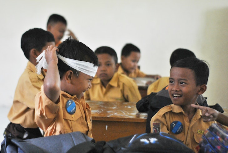 Students in classroom having fun enjoying lesson