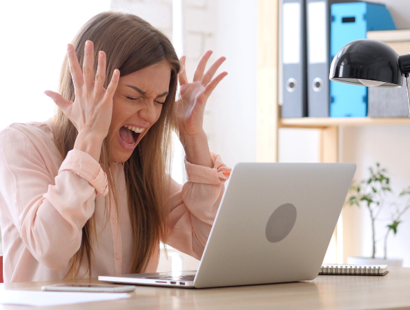 Woman frustrated at her laptop