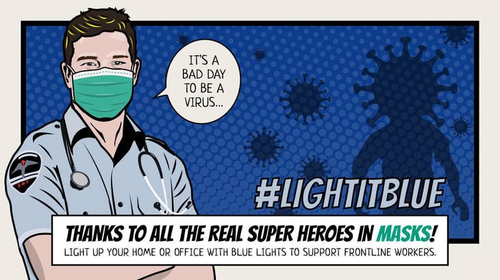 A sign for the light it blue campaign to honor front line workers during the coronavirus pandemic.