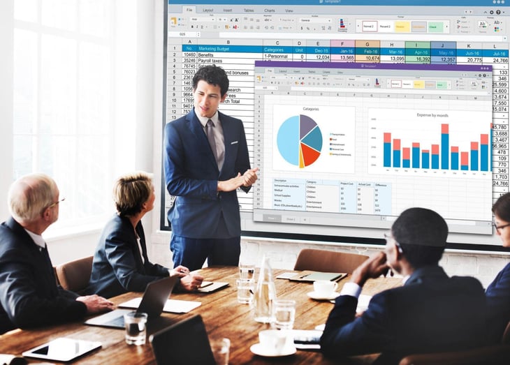 Office personnel discussing the data results of a campaign.