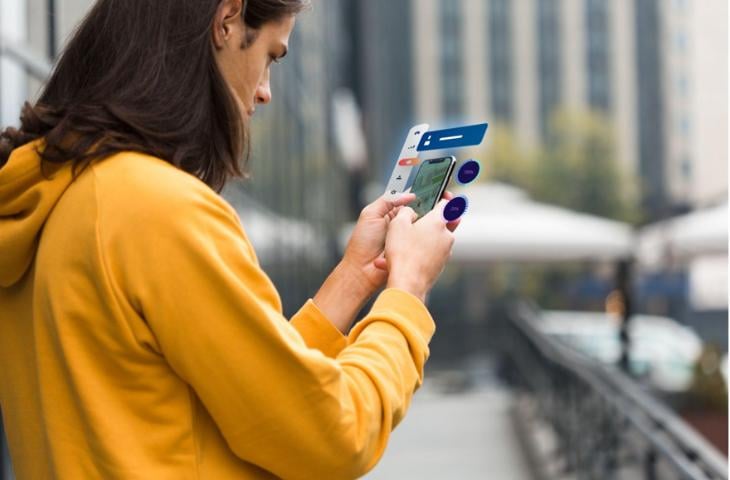  A man connecting with a business on his mobile device.
