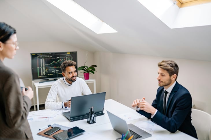 Employees giving feedback while working together.