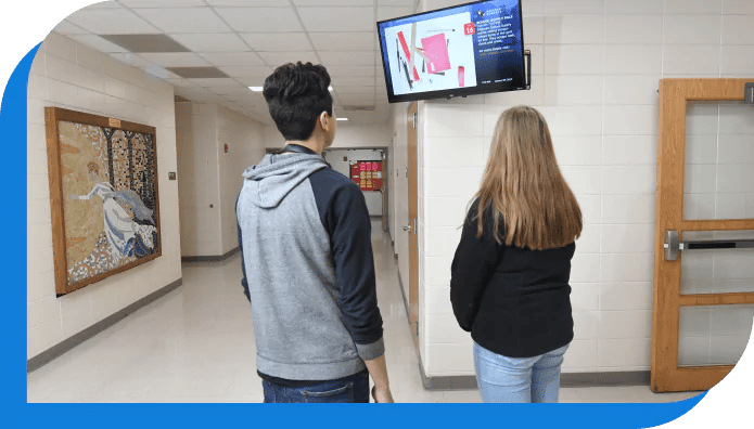 Students looking at digital signage