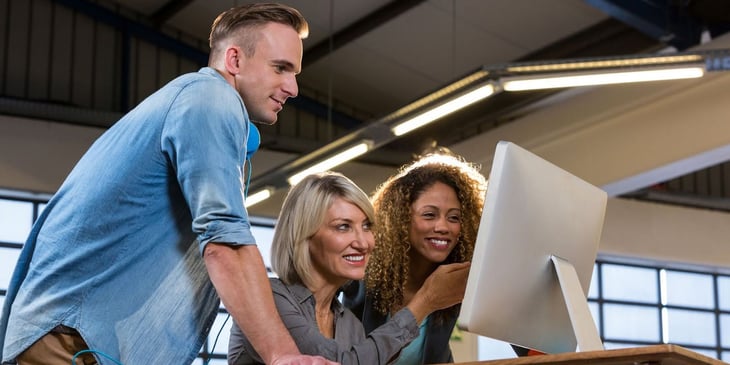 A diverse group of millennials in a modern office setting, symbolizing the future of communication and collaboration in the workplace influenced by millennial trends and preferences.