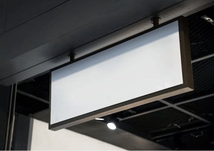 Digital signage hanging from the ceiling. 