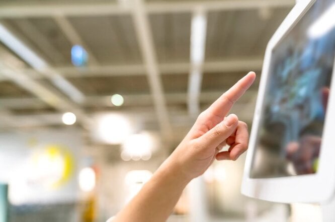 Person interacting with a digital sign. 