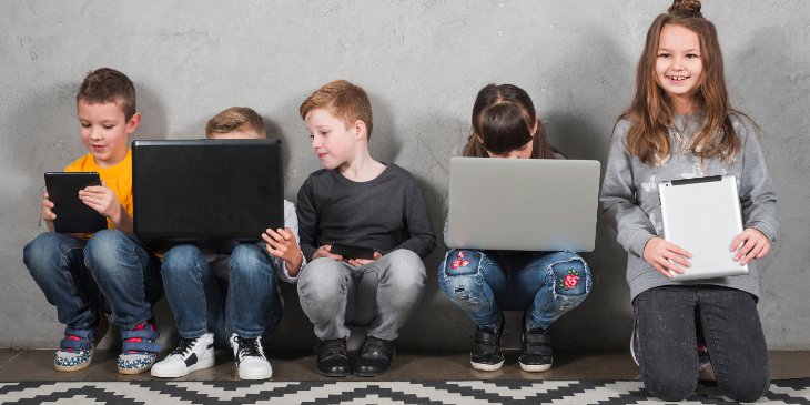 Kids holding digital signage.