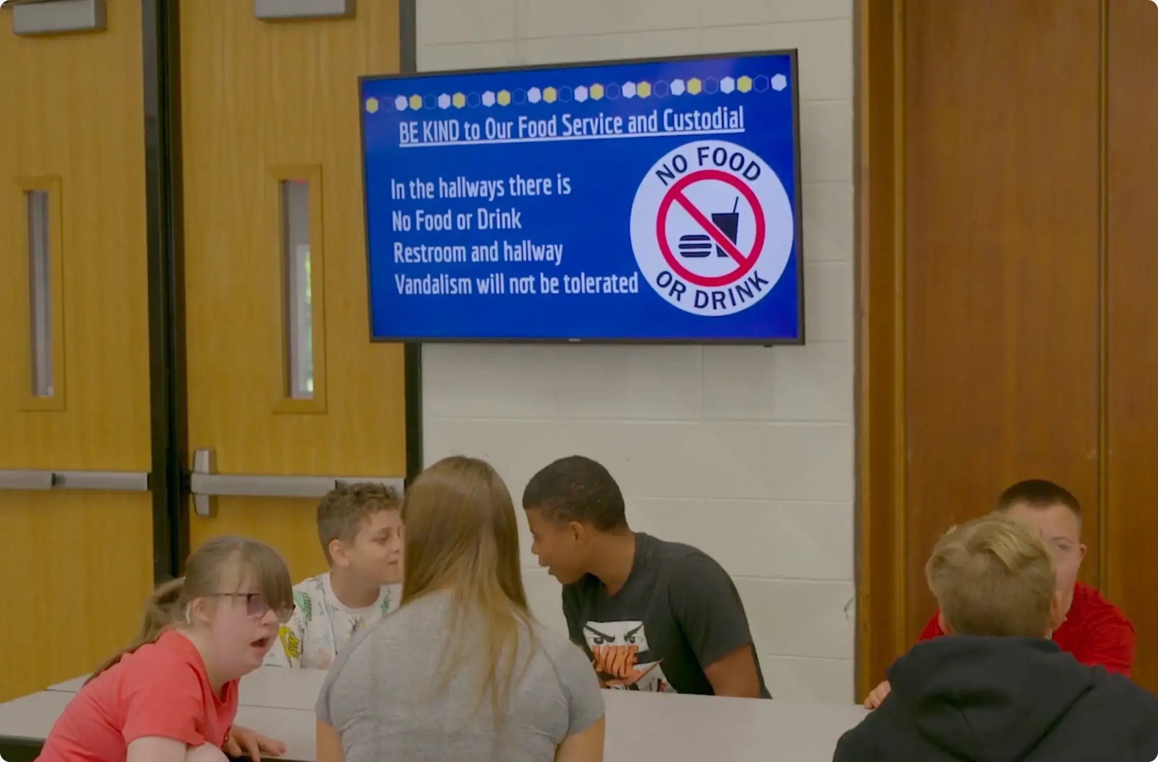 Lunchroom display at a school with digital signage