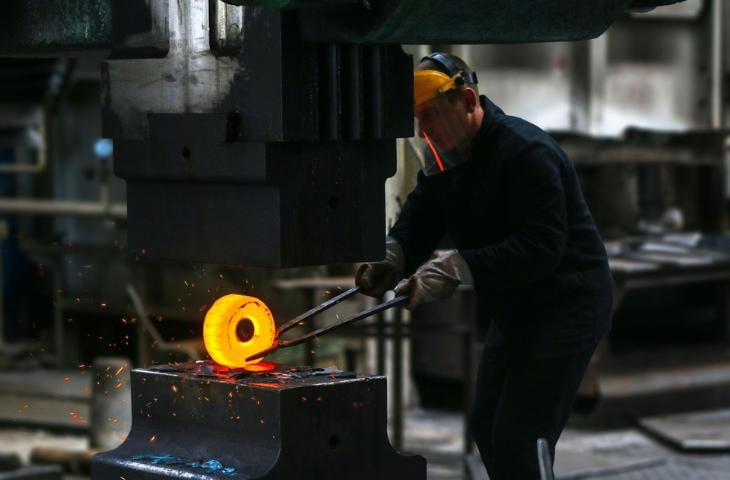 A factory worker wearing personal protection equipment. 