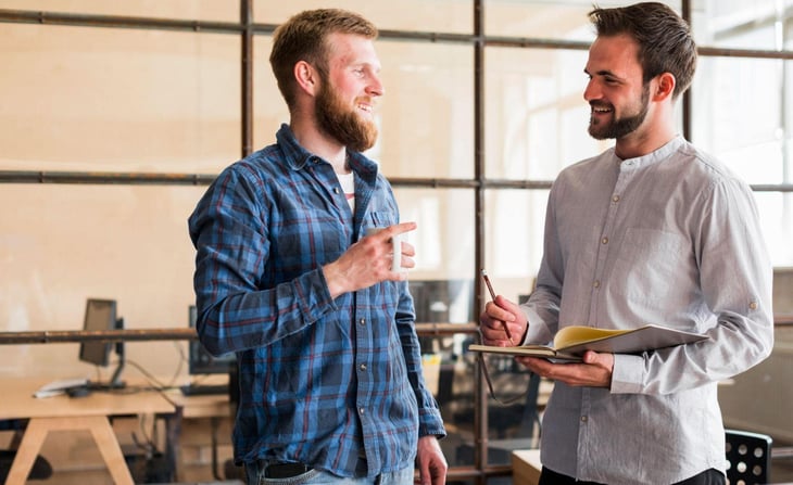 Two men talking. 