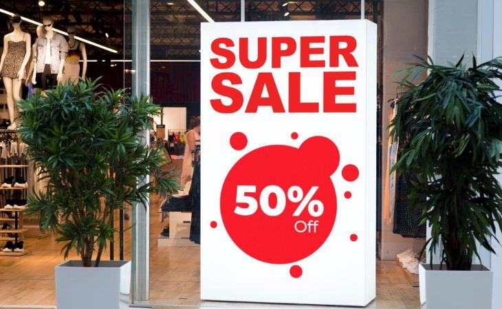 Retail store digital signage advertising offering a 50 percent discount.