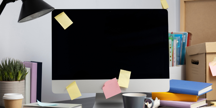 A digital signage screen with sticky notes.