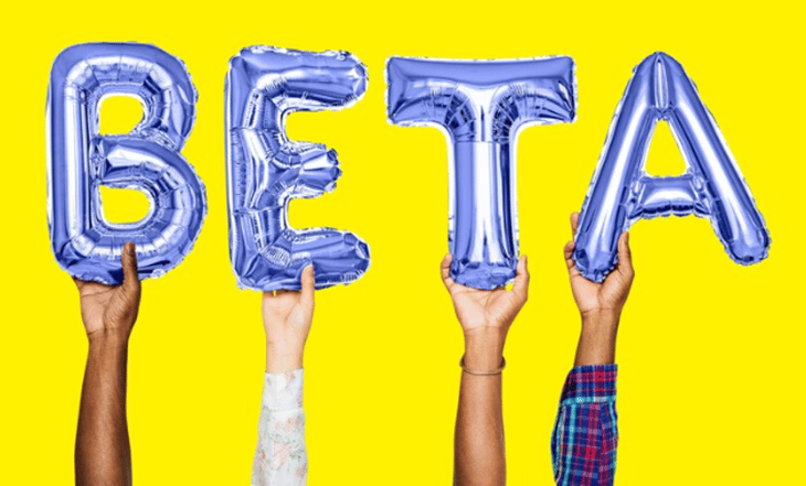 People holding script balloons that say beta.