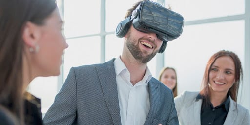 A man wearing a virtual reality headset, immersed in a VR environment, demonstrates how VR technology can enhance communication skills through immersive experiences.