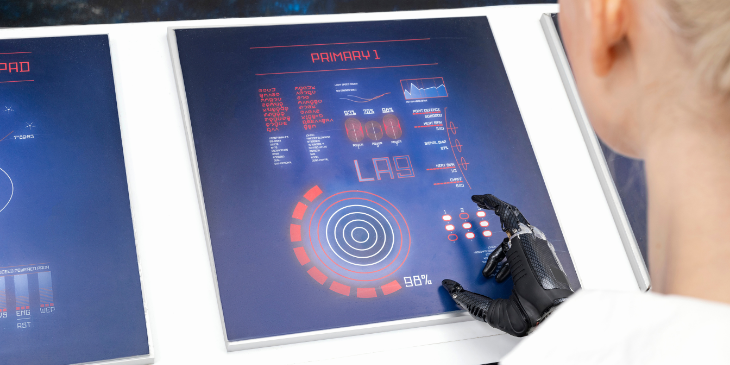A woman working on a digital dashboard in the office.