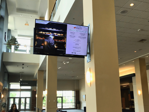 A large digital signage dispaly in a building