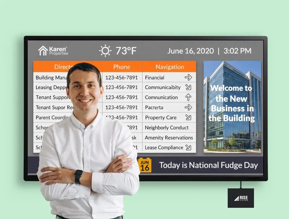 A man standing in front of a building directory