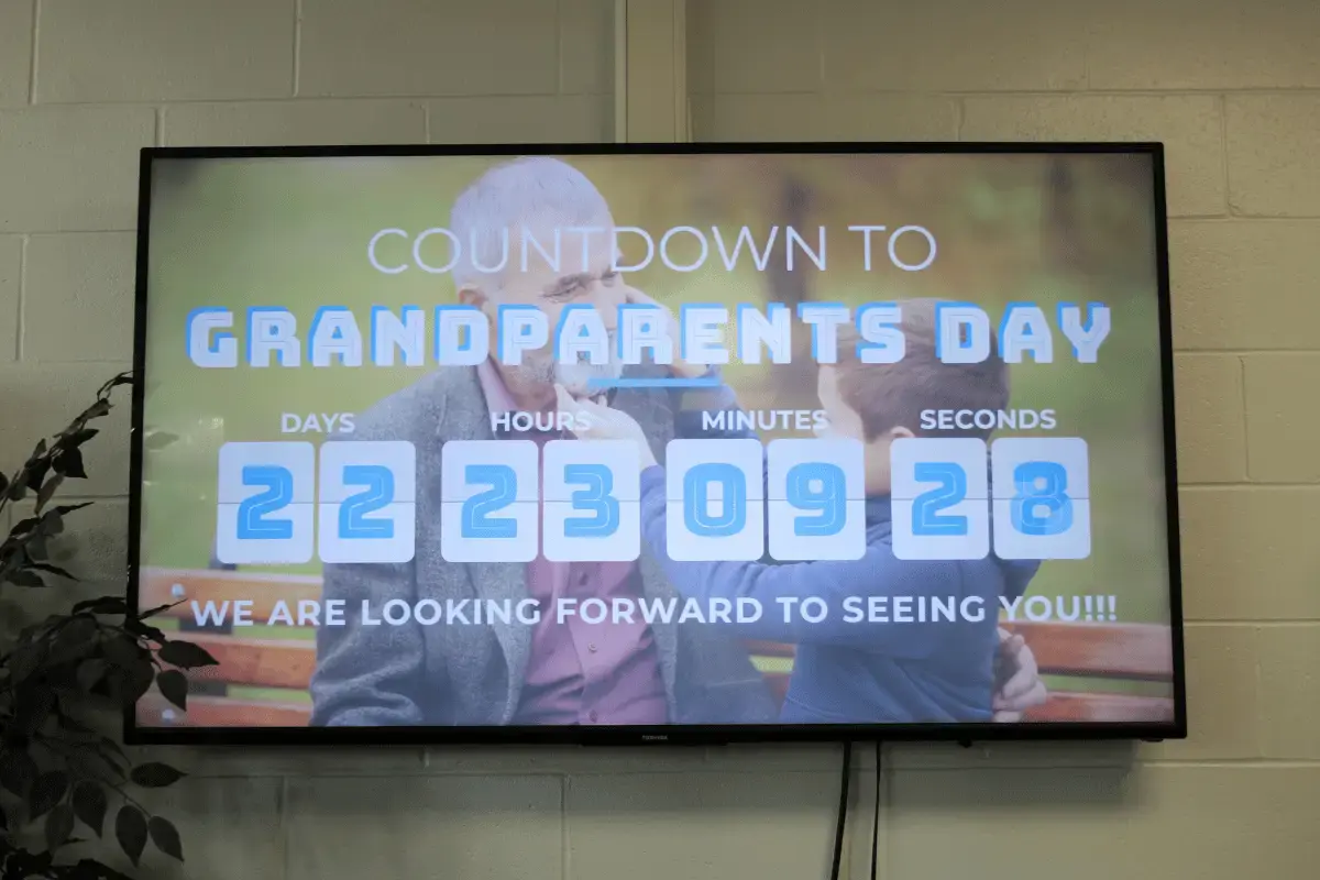 Large digtial signage display showing a countdown timer to a grandparents day celebration