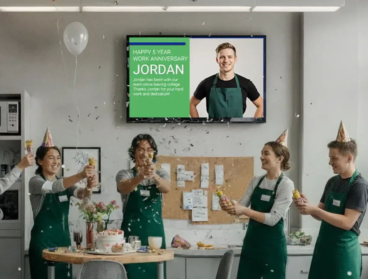 Breakroom of an office with a digital display for Employee Recognition