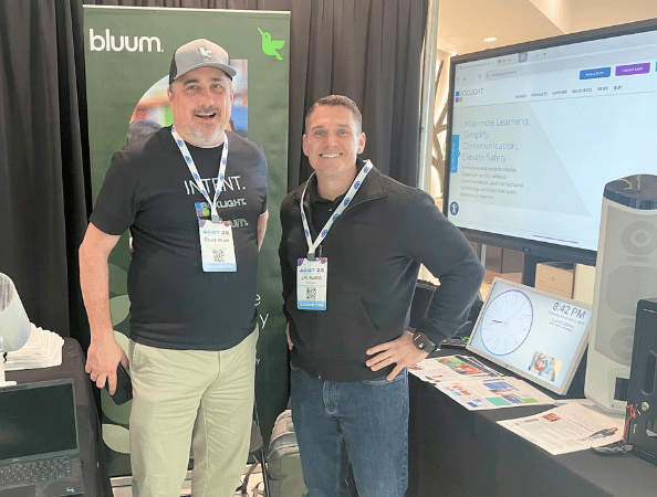 Rise Vision and Bluum reps at an event