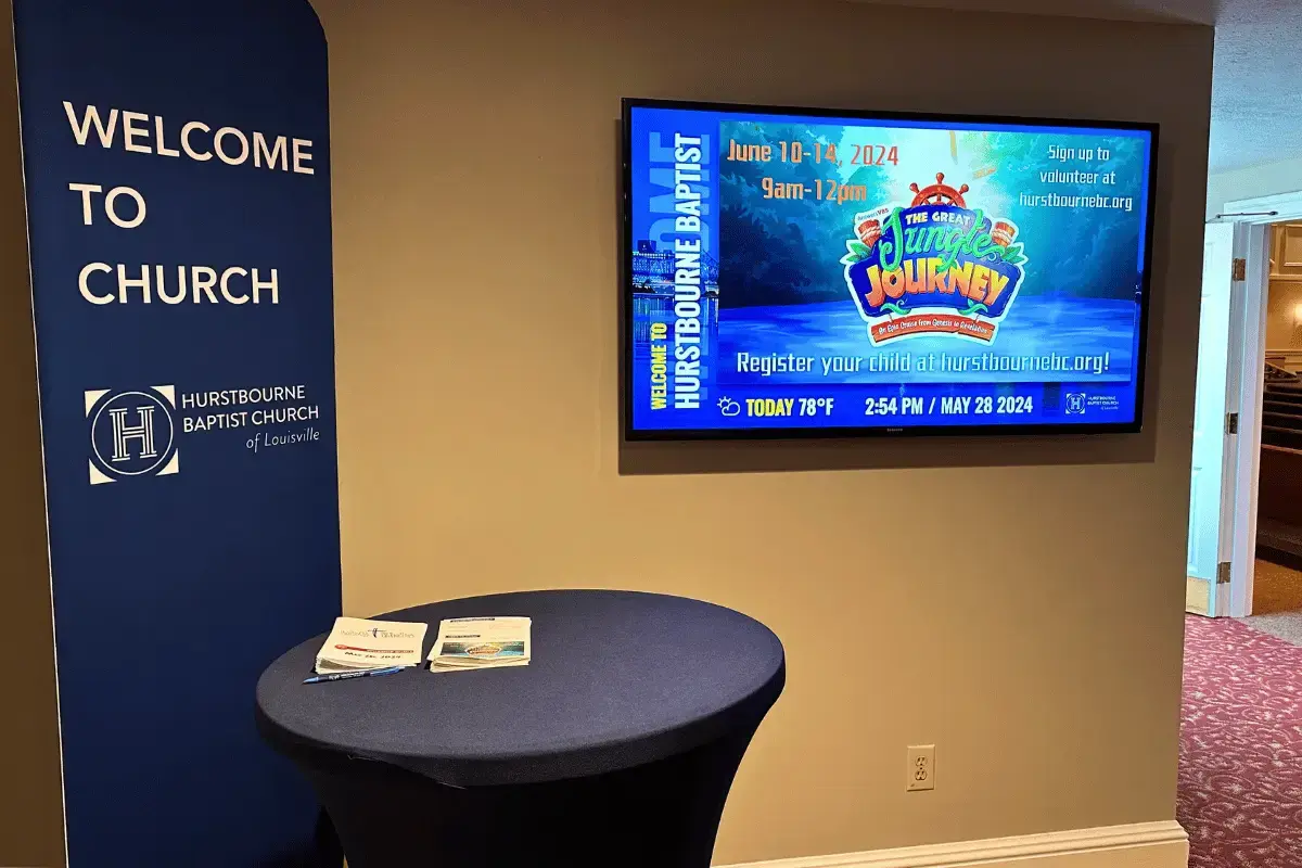 Welcome to church sign next to a digital display