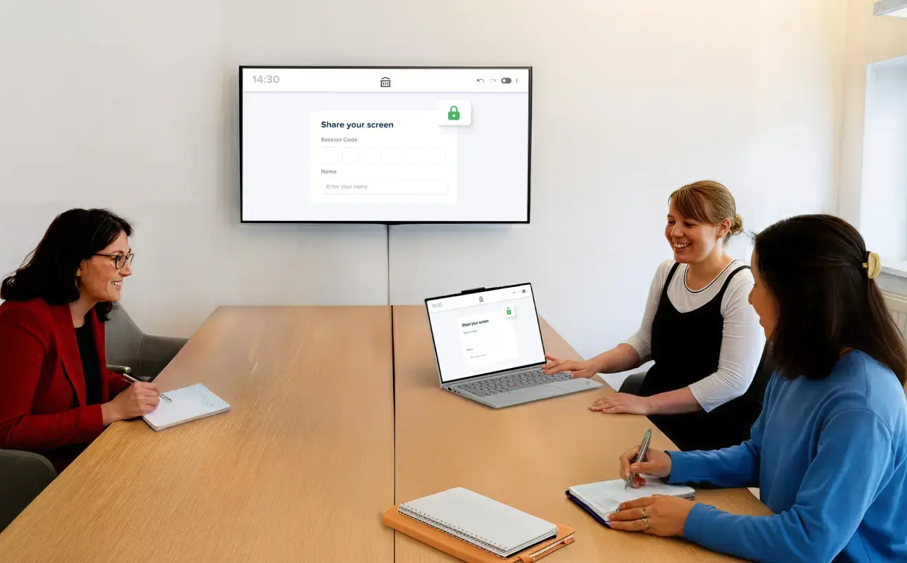 Three females in an office meeting room discussing projects with a large digital signage display mounted on the background wall