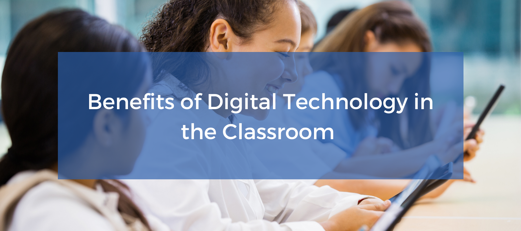 Students using iPads in a classroom with the text benefits of digital technology in the classroom overlaid