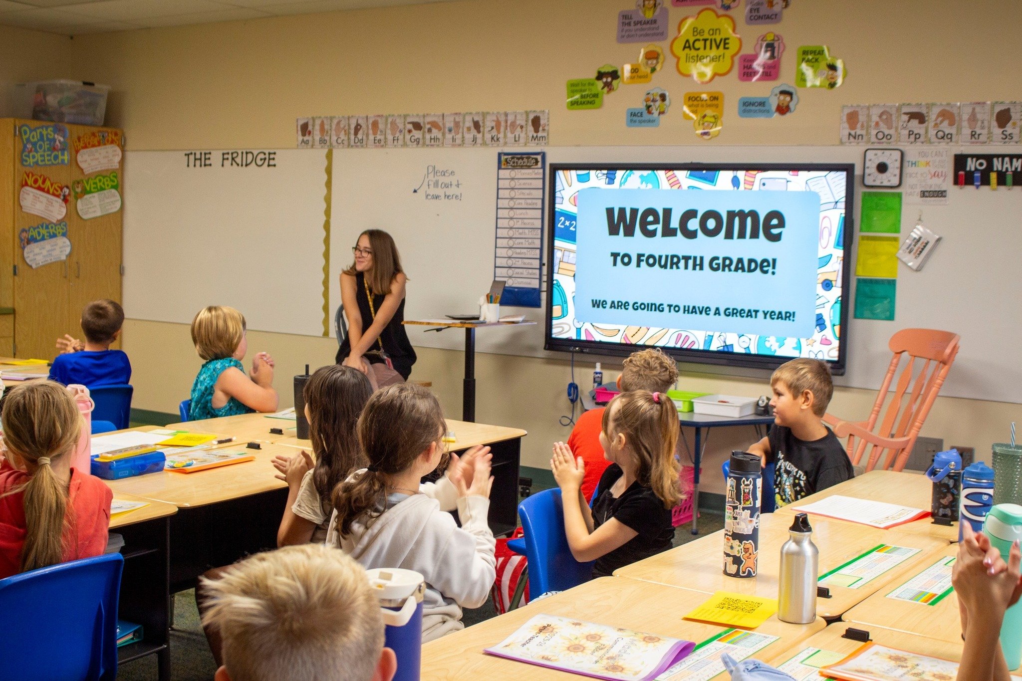 Eudora classroom teacher using digital signage to educate children