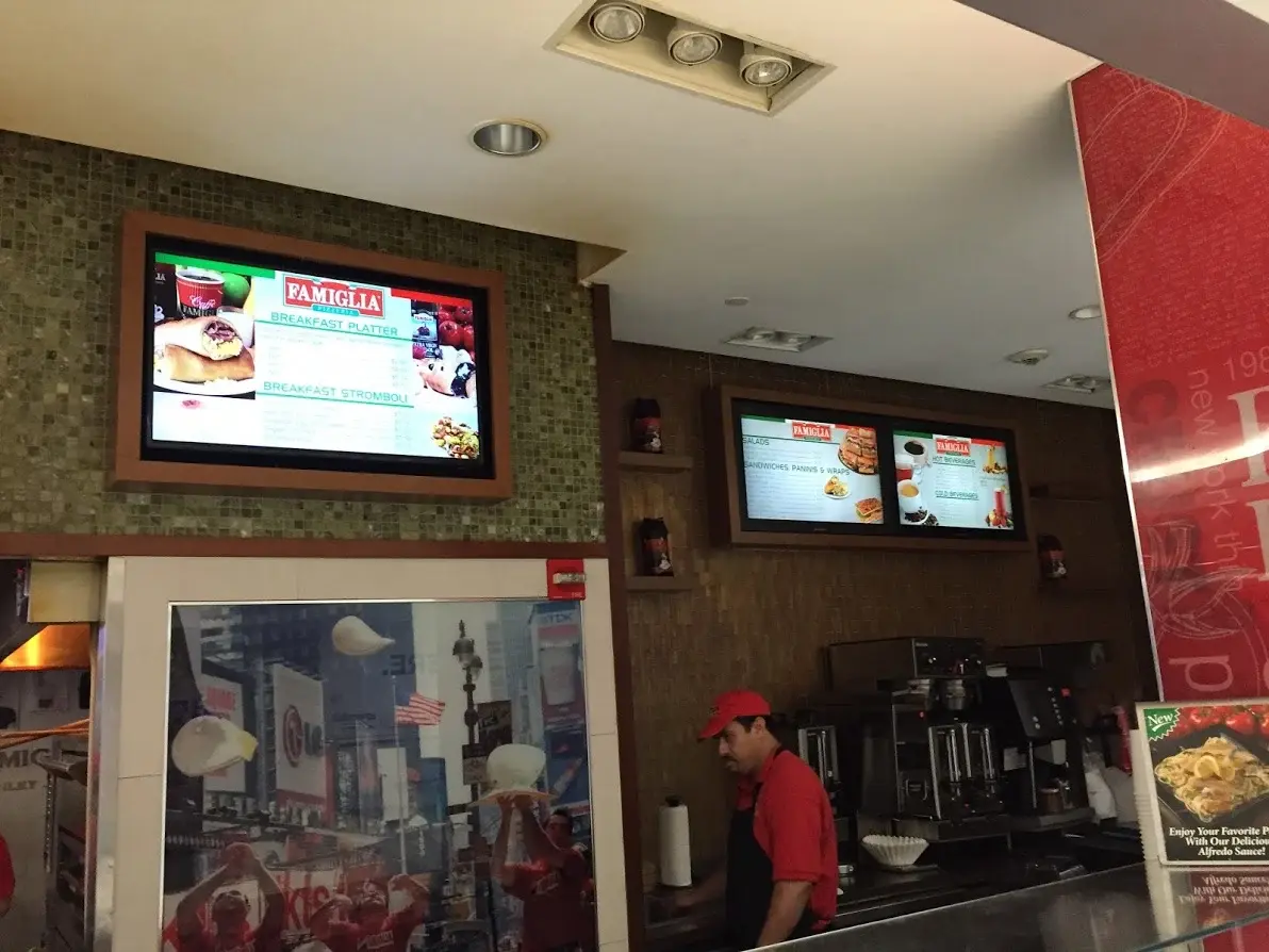 A restaurant displaying digital signage for their menu