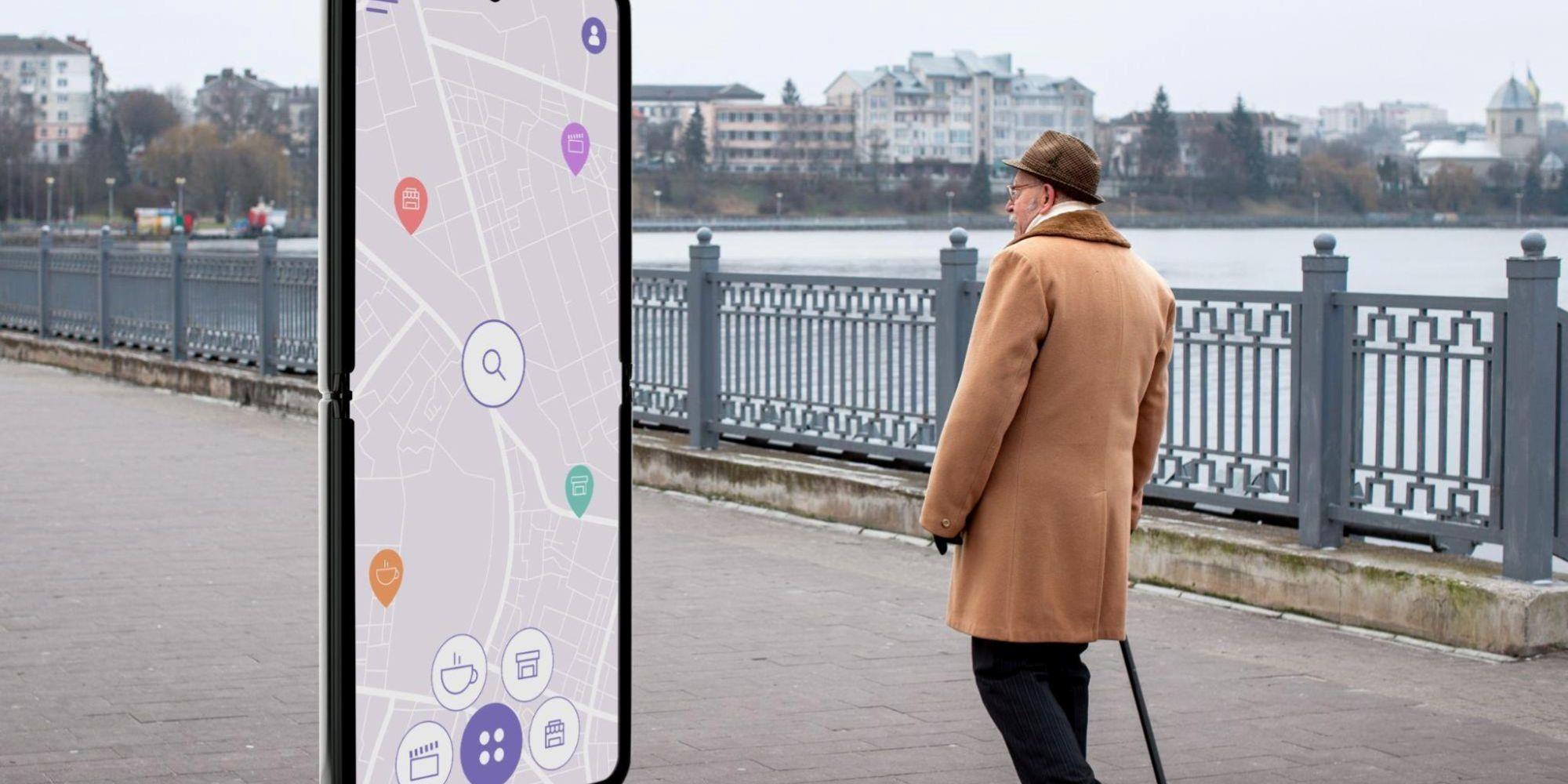 A man looking at a map on a digital signage screen.