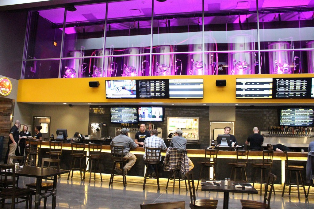 flix brewhouse digital signage above bar