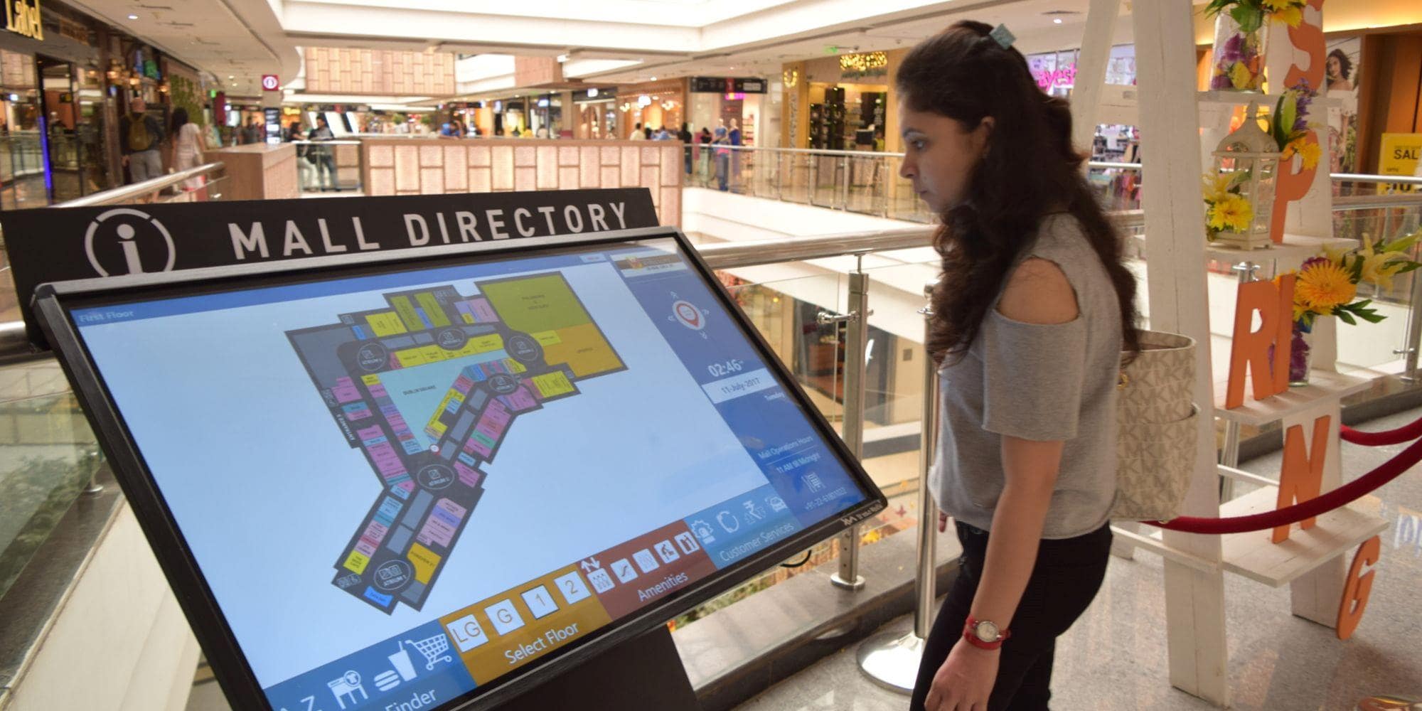 An Interactive mall directory helping a shopper better navigate the shops, floors, and amenities that the mall has to offer.