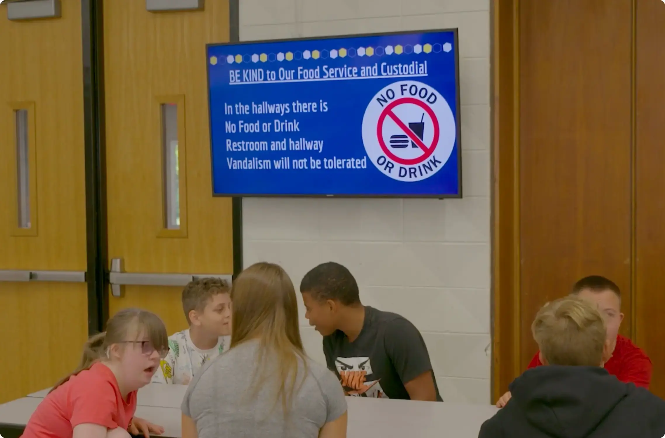 Lunchroom display at a school with digital signage