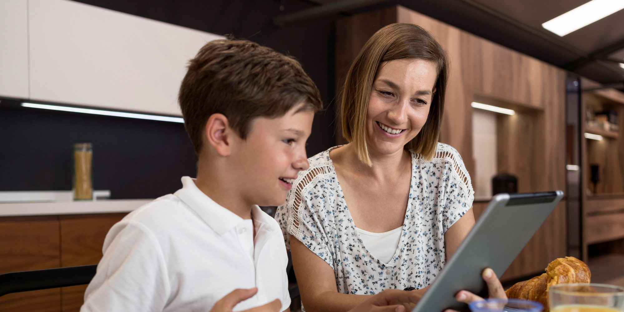 Teacher using a digital signage with a student.