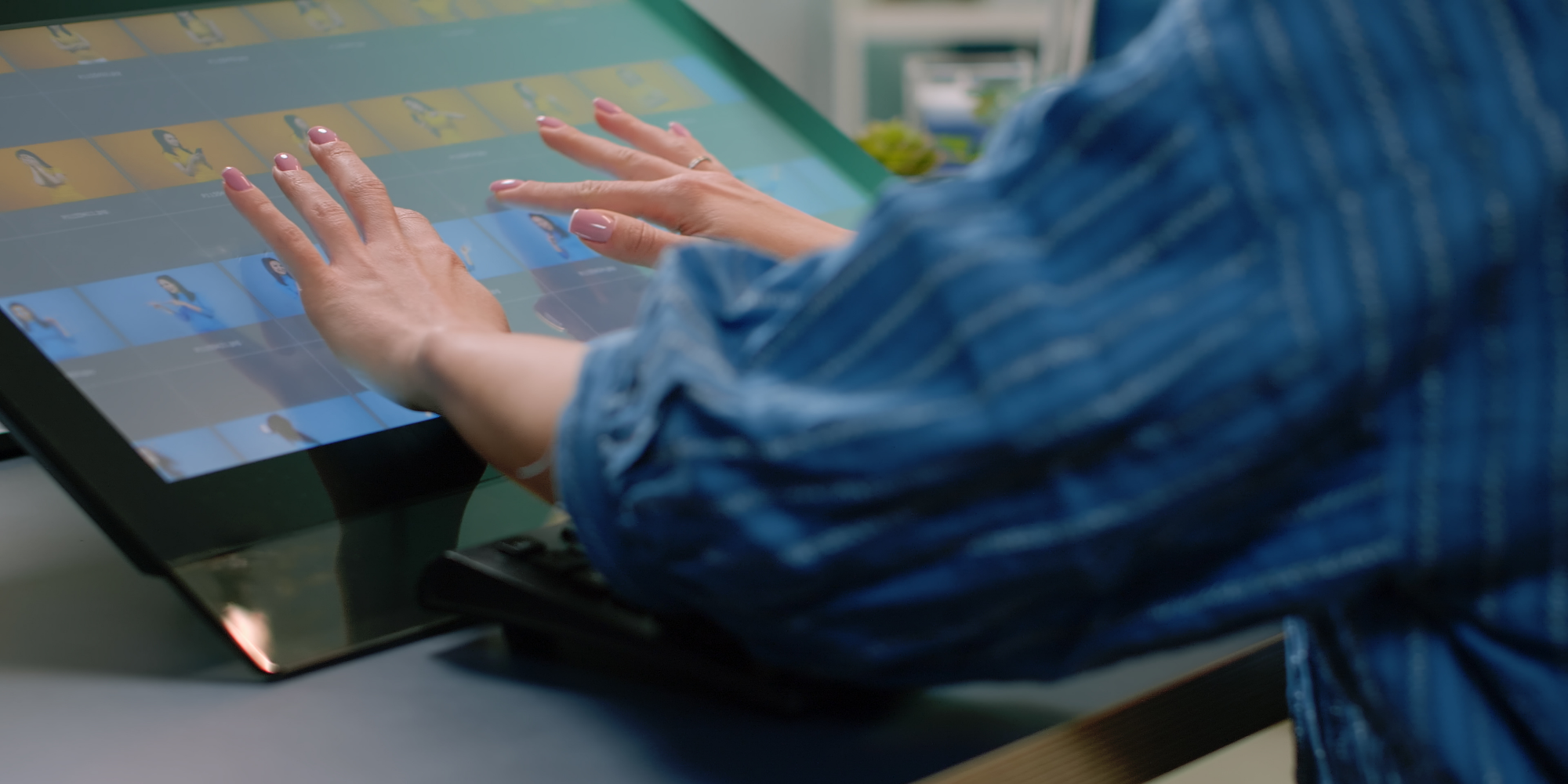 A woman working on a digital dashboard.
